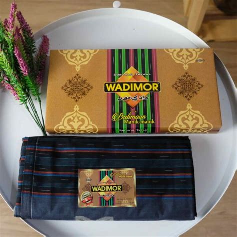 harga-sarung-wadimor-kemasan-dus-Dus-Analisis